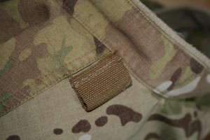 Step 8 - Cordura tabs are stitched onto the jacket so we can attach a section of camo net which can then be removed to allow it to be washed.